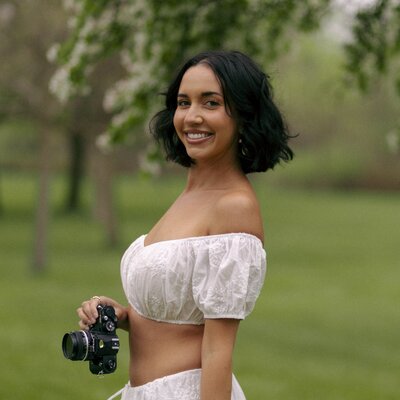 photographer leaning against the wall