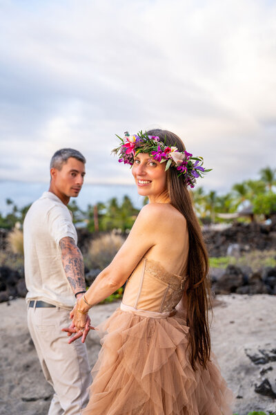 Couple on beach for engagement portraits with Big Island photographer