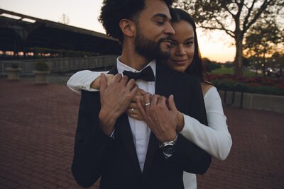 Bride and groom in formalwear sharing a sweet moment before their wedding ceremony