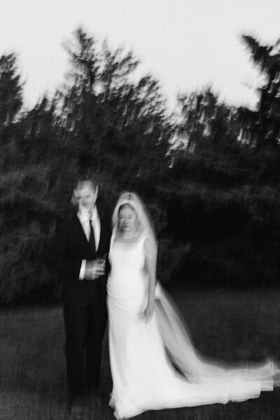 Bride and groom under bride's veil