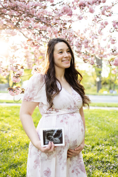 maternity portrait in cherry blossoms at reading museum