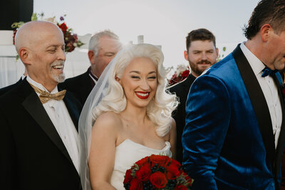 bride Makenzie in vintage gown with red lip and retro waves by MaKall