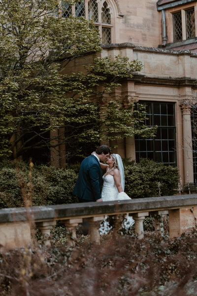 Couple hugging by a mountain