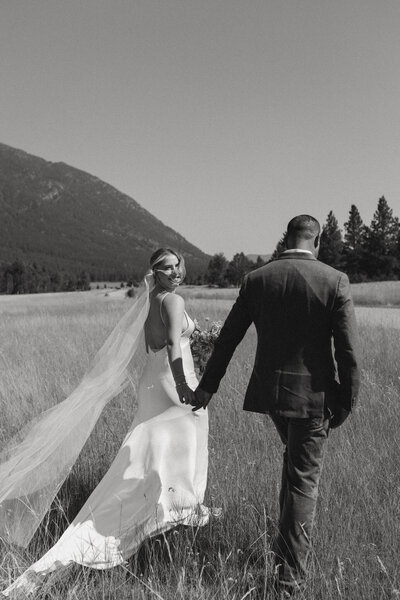 bride and groom walk away from their cranbrook wedding ceremony
