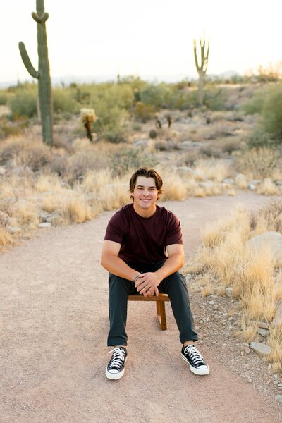 senior boy posing for senior photos in north scottsdale az