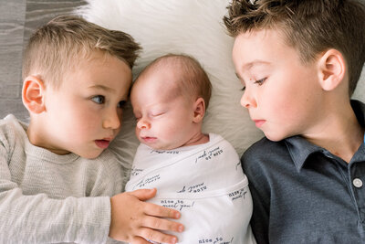 In-home lifestyle Newborn Photo session, sibling love, taken in Lake Forest, California