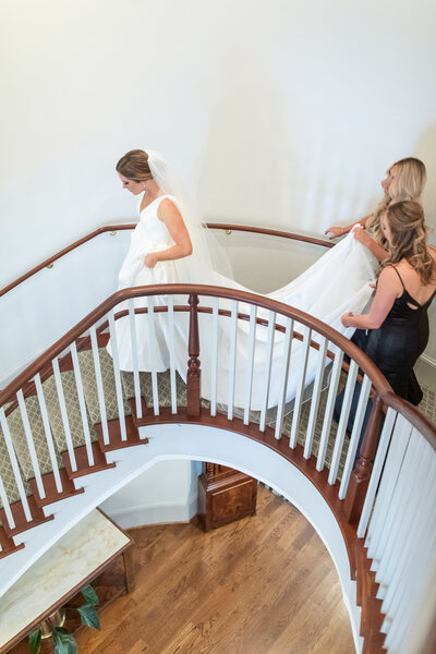 bride going down grand staircase