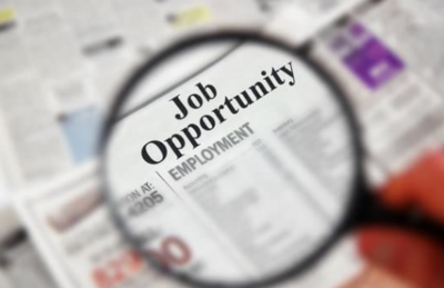 Magnifying glass over a newspaper classified with "Job Opportunity" text;  zimmytws's Images