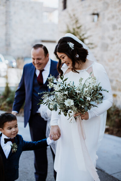 Bride and groom walk up memorial steps at their DC wedding