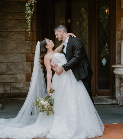 Groom dipping bride.