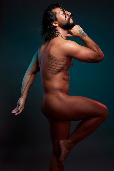 Side-profile nude portrait of Rolando Tamez highlighting form and strength, shot by Ylva Erevall.