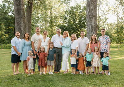 Large family looking at camera during family photos at Forest Park