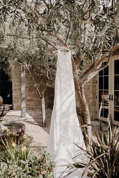 Wedding dress hang in Mediterranean flare garden