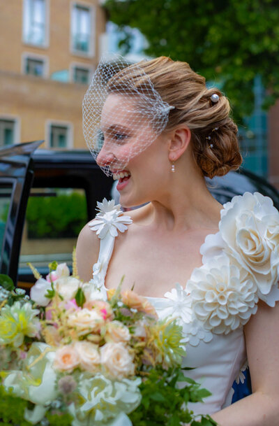 Bride exiting London taxi