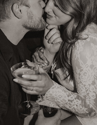 Engaged couple taking engagement photos at The Hewing Hotel in downtown Minneapolis