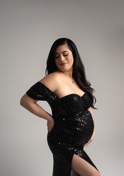 Sparkling sequin dress with off-shoulder neckline and thigh-high slit