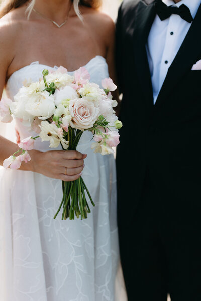 Wedding couple walking down the isle after their ceremony. They holding hands, laughing. Taken at Liriodendron Mansion. 