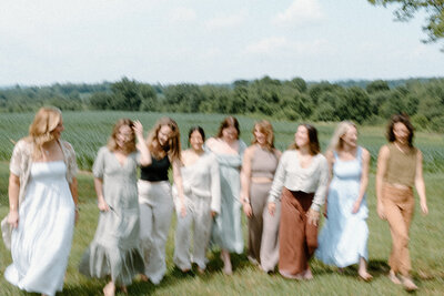 Motion blur image of the Alyn Wellness Studio team walking in a field