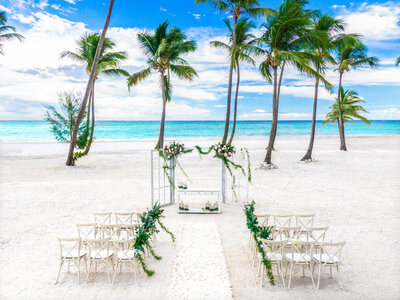 Elegant beach wedding ceremony site set-up