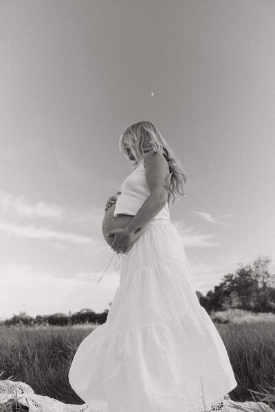 Luxury fine art maternity photograph with emotive documentary style.