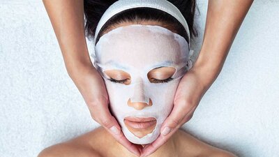Honolulu anti-aging sheet mask being used on a client at J Marikit beauty salon, Aiea.