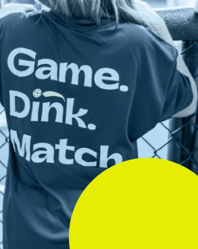 child wearing baseball cap watching pickleball