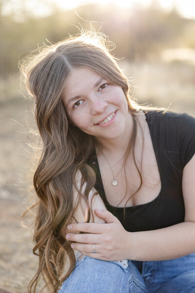 high school senior girl at beautiful park.