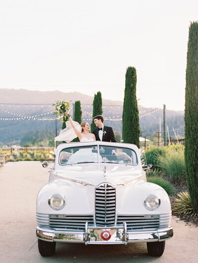 couple in getaway car, wedding in napa valley