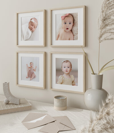 Wall gallery of 4 framed portraits of baby's first year.