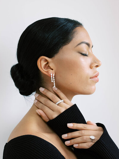 Side profile of model wearing jewelry from Or & Elle Diamonds