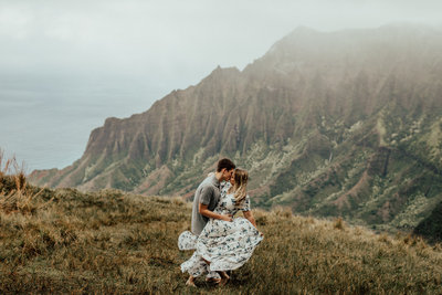couple kissing on the mountain