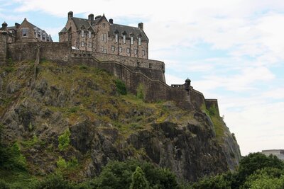 Edinburgh castle on a hill with a view of the city
