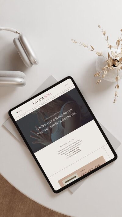 Showit website mockup for La Casa Rosa, a wellness and nutrition brand, displayed on a tablet. The website highlights intuitive movement, nutrition, and body connection with a clean and minimal design