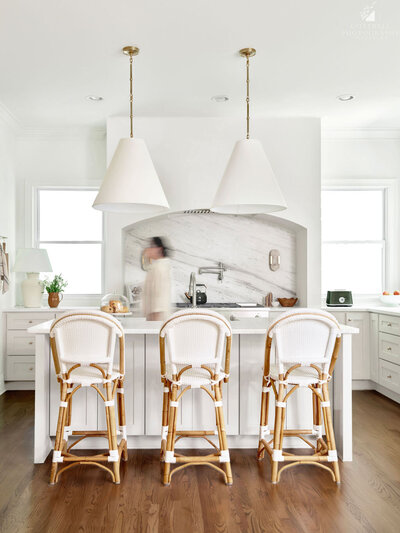 Timeless kitchen design in Roswell, Georgia with custom cabinetry, statement lighting, and functional layout by Megan Paterson Interiors.