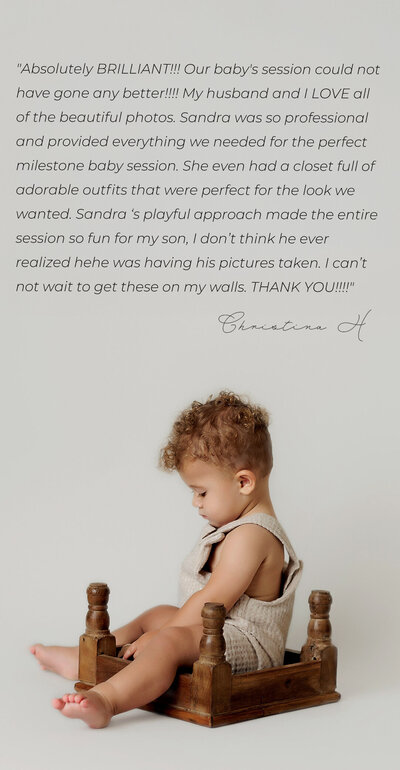 Profile of a baby boy with curly hair sitting sideways inside and upside down square wooden stool