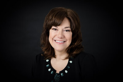 Professional business headshot of woman smiling in Buffalo, New York