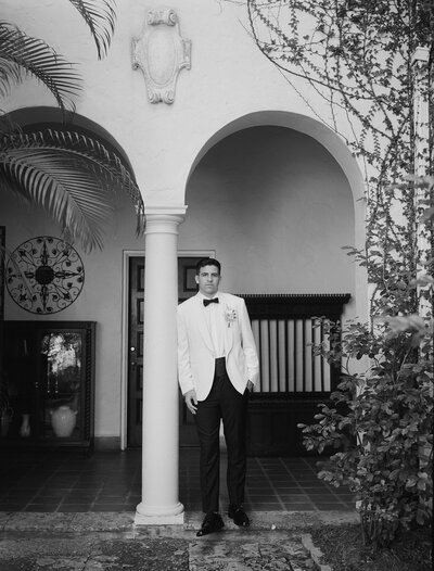 Couple in wedding attire dancing together on the dance floor
