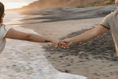 Blurry photo of a couple holding hands on the beach