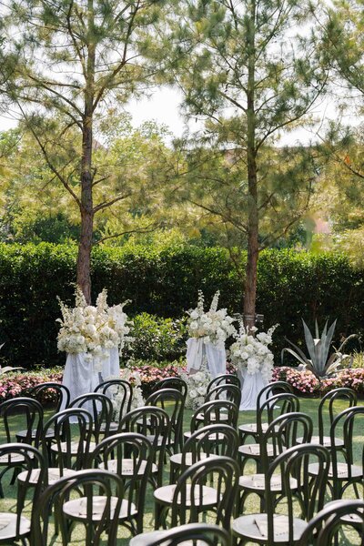Wedding ceremony chairs and flowers