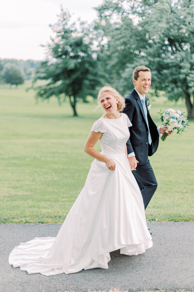 Bride and groom walking in Rochester, NY wedding
