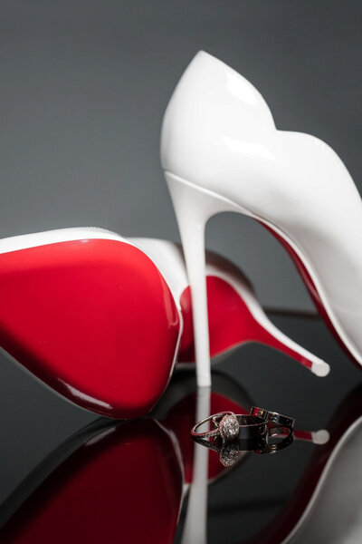Red bottom Louboutin heels and wedding rings styled for detail shot at Union Club Hotel