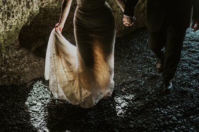 Couple walking black sand elopement wedding maui