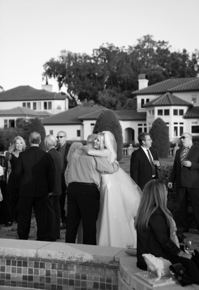 Bride hugging wedding guest taken by top jacksonville wedding photographer Shelby Ann Photos
