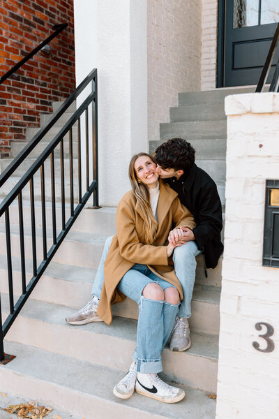 Stunning downtown couples session with man and woman holding each other on the stairs