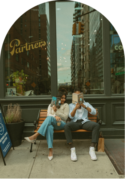lifestyle session in New York City with couple sitting on a bench outside