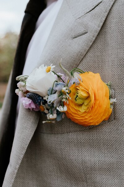 Groom with orange boutonierre