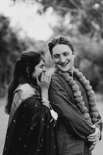 Couple laughing during their wedding portrait session on an inside joke captured by Wedding photographer in Melbourne