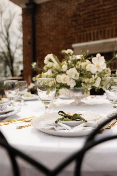 A romantic and elegantly styled couple’s table at a Cincinnati wedding reception, adorned with florals.