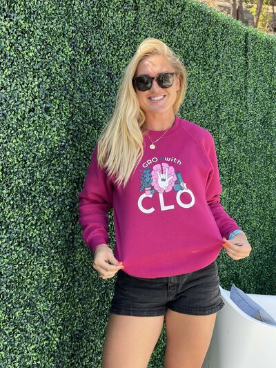 Chloé Maleski posing in her GrowithClo sweatshirt