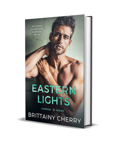 man with beard wearing a white shirt looks down on the cover of the air he breathes by romance author brittainy cherry